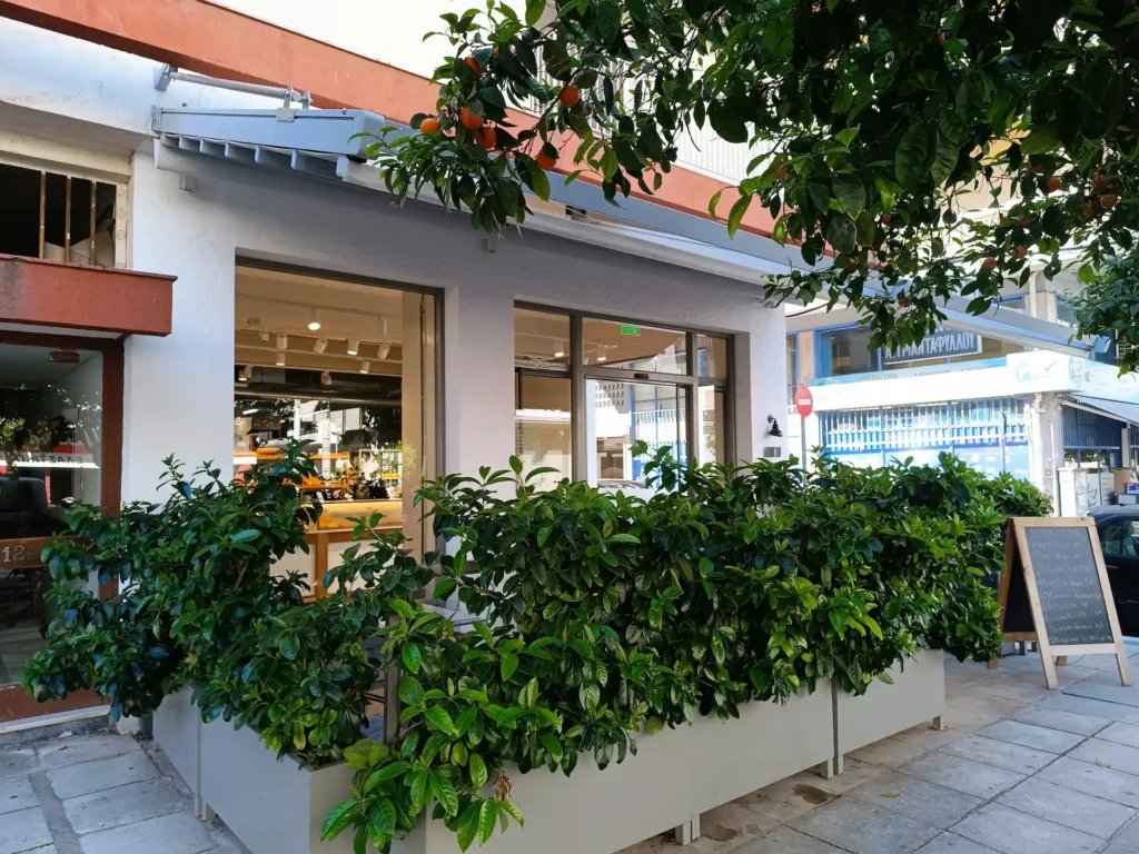 Outside of the bakery with green nature